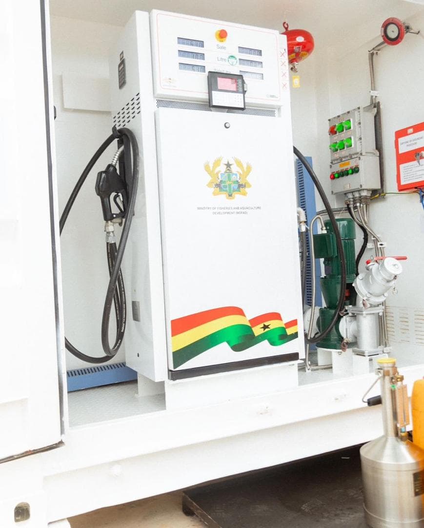 White automated fuel dispenser with hoses and pump controls